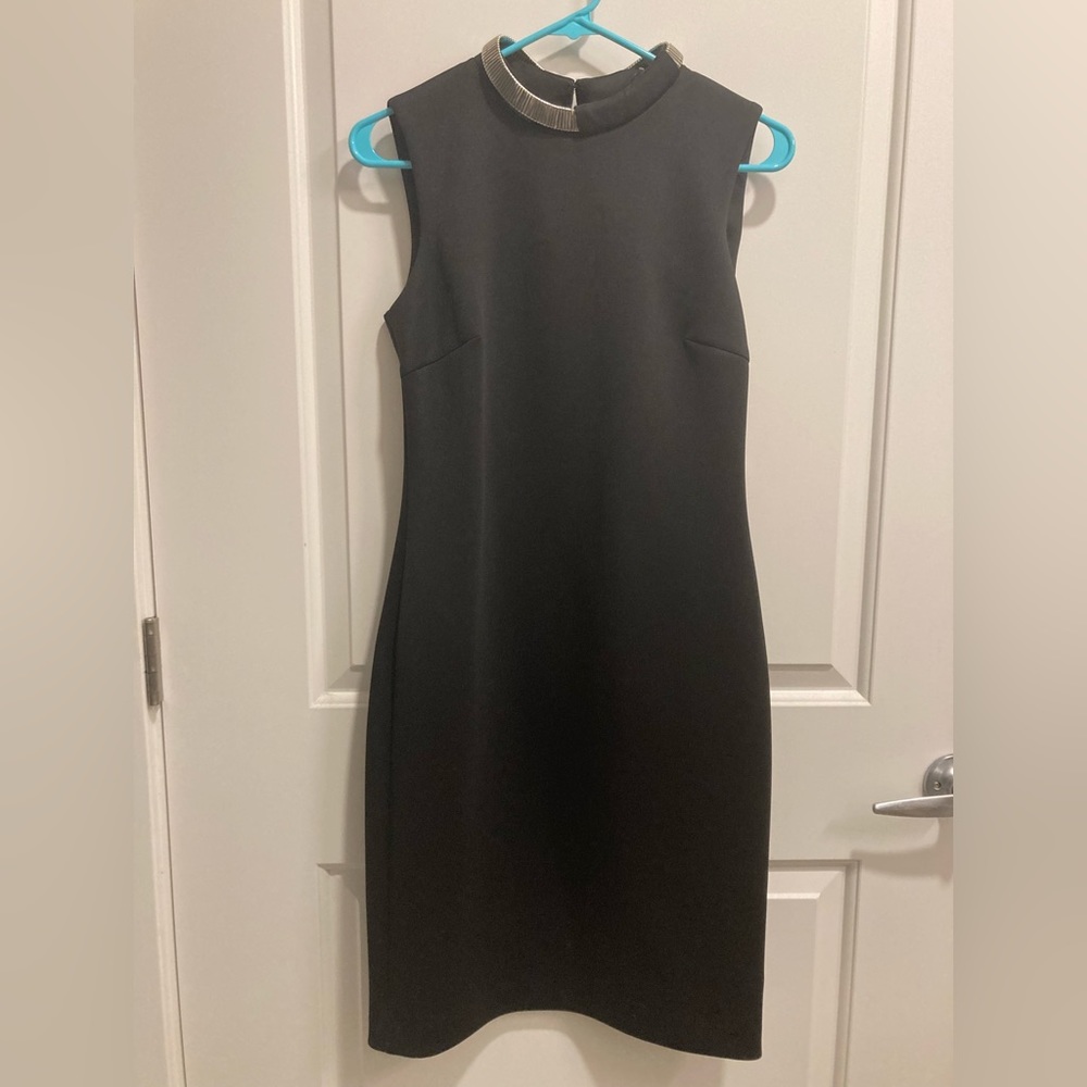 Little black dress with silver collar detail. Calvin Klein. Size 6.